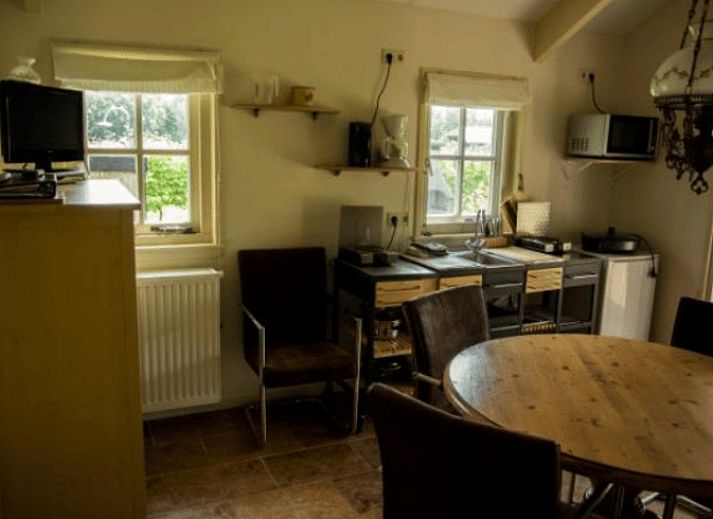 Cottage in Terwolde, cottage with terrace in Veluwe, Gelderland, surrounded by greenery and tranquility.