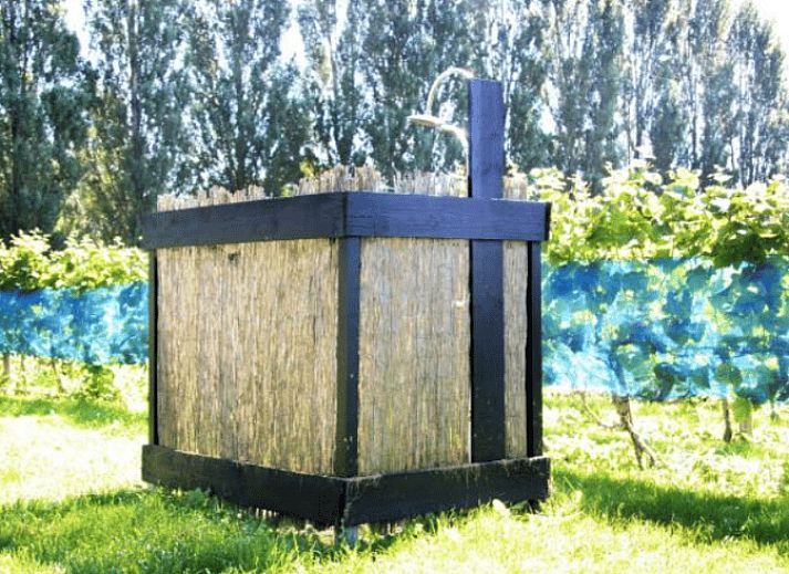 Porch of Cottage in Terwolde, vacation home in Veluwe, Gelderland, overlooking vineyards.