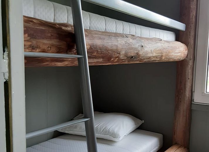 Geniessen Sie die ruhige Veranda des Ferienhauses in Garderen, das inmitten der wunderschoenen Natur der Veluwe in Gelderland liegt.