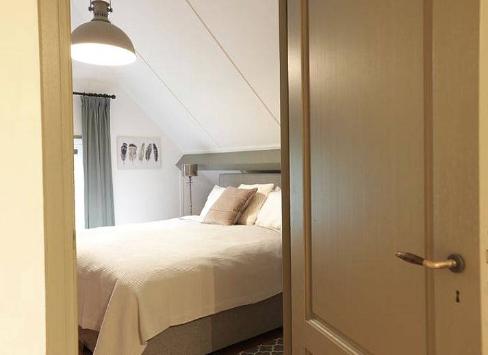 Ferienhaus in Garderen, Ferienunterkunft in der Veluwe, Gelderland, mit schoener Terrasse und umliegender Natur.