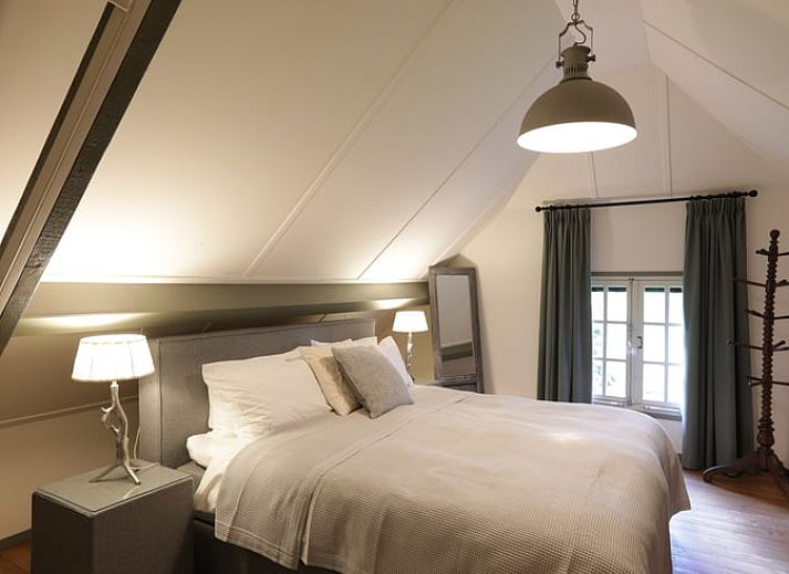 Ferienhaus in Garderen, Ferienunterkunft in der Veluwe, Gelderland, mit schoener Terrasse und umliegender Natur.