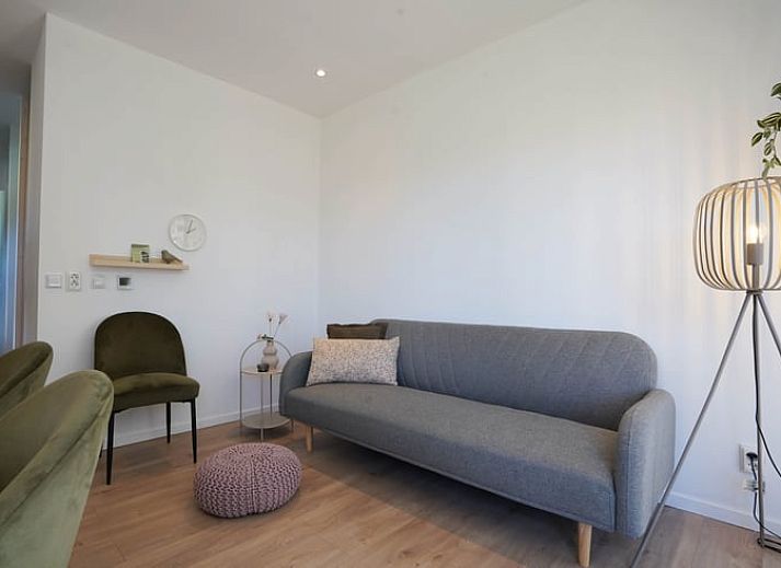 Spacious veranda of cottage in Elspeet overlooking green garden, Veluwe, Gelderland.
