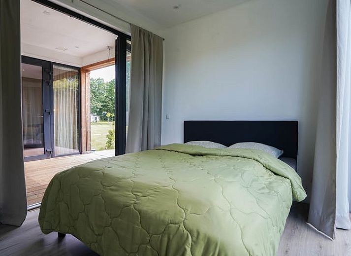 Open terrace of cottage in Elspeet with glass doors, located in Veluwe, Gelderland.