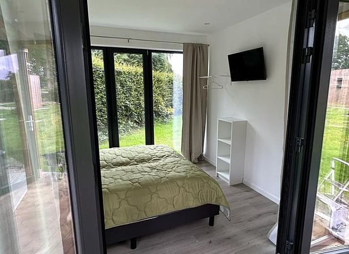 Open terrace of cottage in Elspeet with glass doors, located in Veluwe, Gelderland.