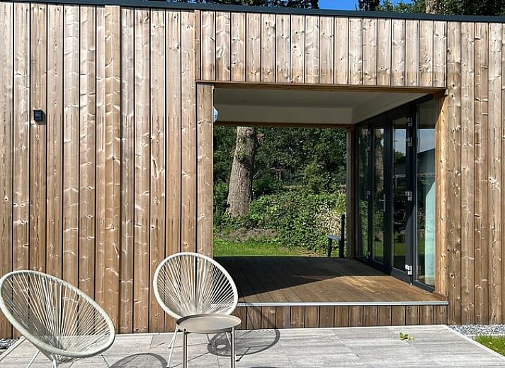 Open terrace of cottage in Elspeet with glass doors, located in Veluwe, Gelderland.