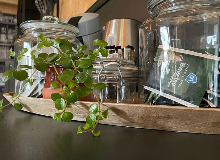 Dining room in Holiday Home in 't Harde, Veluwe, with modern furnishings and lots of natural light.