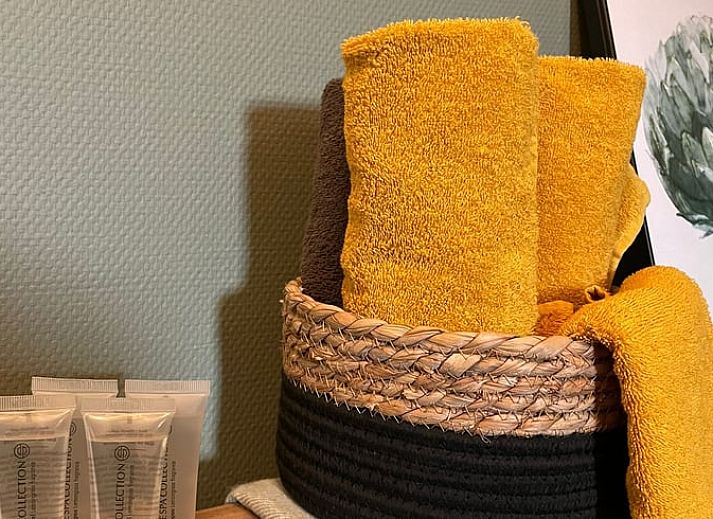 Dining room in Holiday Home in 't Harde, Veluwe, with modern furnishings and lots of natural light.