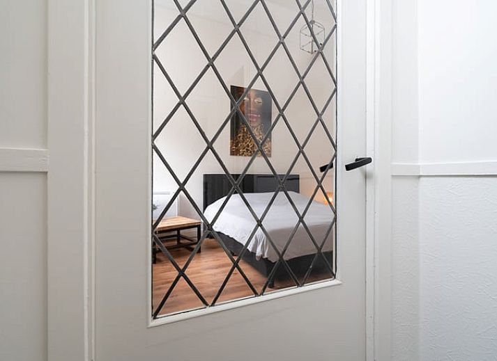 Stylish living room of Holiday Home in 't Harde, Veluwe, Gelderland with modern decor and lots of natural light.