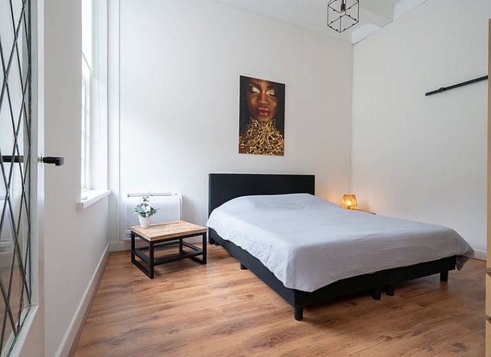 Stylish living room of Holiday Home in 't Harde, Veluwe, Gelderland with modern decor and lots of natural light.