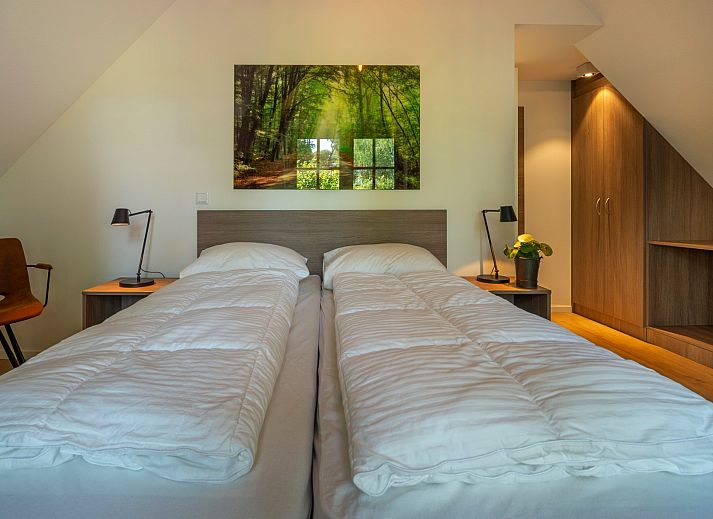 Overdekte zithoek op het terras van Vakantiewoning Sprielderbosch 14 't Sprielderhof in Putten, Veluwe.