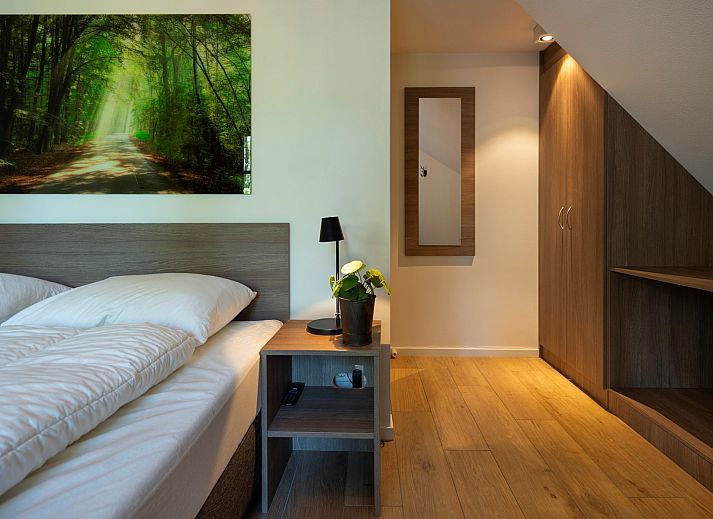 Overdekte zithoek op het terras van Vakantiewoning Sprielderbosch 14 't Sprielderhof in Putten, Veluwe.