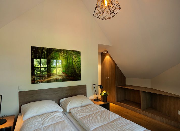 Overdekte zithoek op het terras van Vakantiewoning Sprielderbosch 14 't Sprielderhof in Putten, Veluwe.