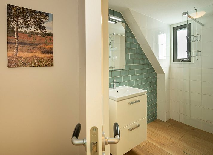 Buitenzicht van Vakantiewoning Sprielderbosch 14 't Sprielderhof omgeven door Veluwse natuur.