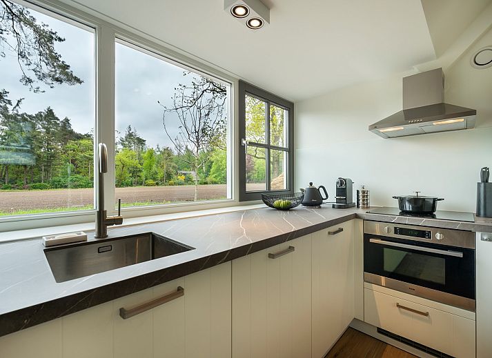 Verken de groene omgeving van Vakantiewoning Sprielderbosch 45 'Skogen' in Putten, Veluwe, Gelderland.