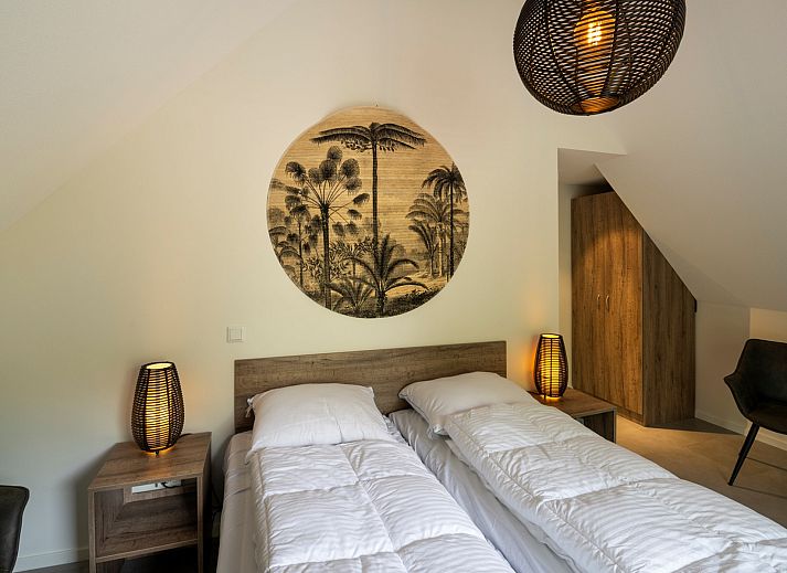 Gezellige woonkamer van Vakantiewoning Sprielderbosch 29 'Casa Esther' op de Veluwe met moderne inrichting in Putten.