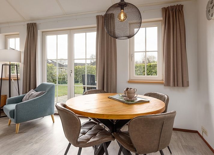 Bungalow 2 in Putten, Veluwe, Gelderland with sunny terrace and green surroundings, ideal vacation home for nature lovers.