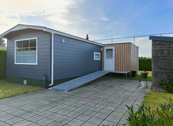Attractive bedroom in DG1546 vacation home Putten Veluwe with natural light and comfortable furnishings.