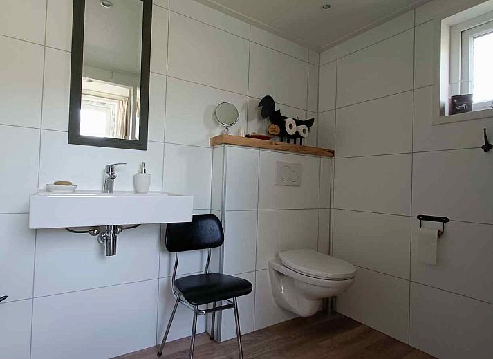 Attractive bedroom in DG1546 vacation home Putten Veluwe with natural light and comfortable furnishings.