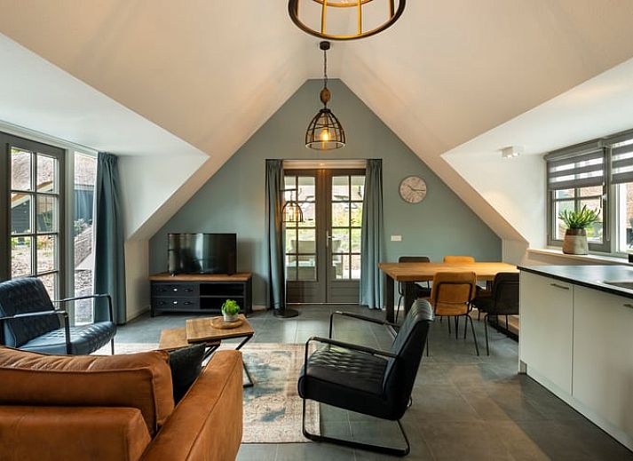 Charmantes Ferienhaus in Putten, Veluwe mit Reetdach und gruenem Garten in Gelderland.