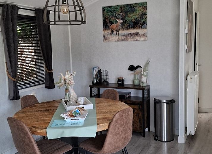 Enjoy the peace and quiet on the terrace of Chalet Relax in Putten, Veluwe. Perfect vacation home for nature lovers in Gelderland.