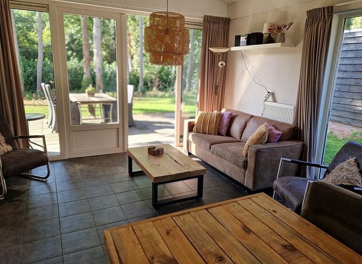 Charming vacation home in Putten, Veluwe, Gelderland with green surroundings and cozy outdoor space.