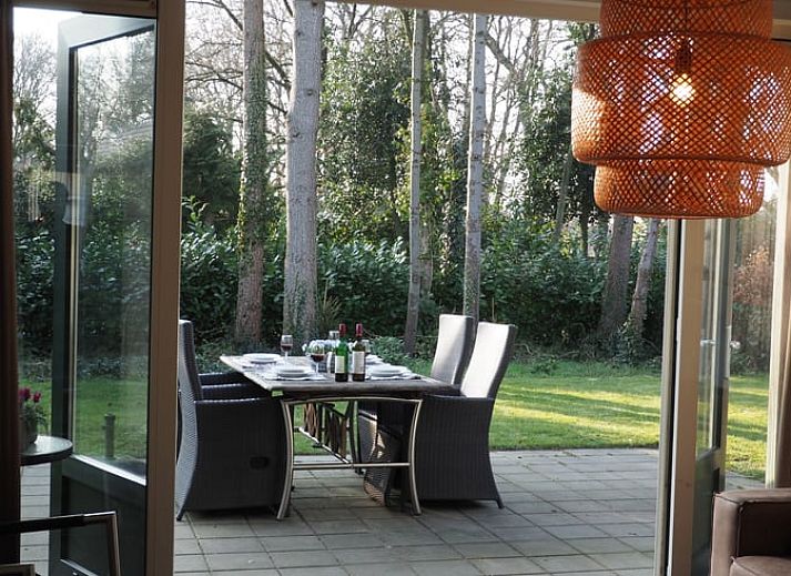 Charming vacation home in Putten, Veluwe, Gelderland with green surroundings and cozy outdoor space.