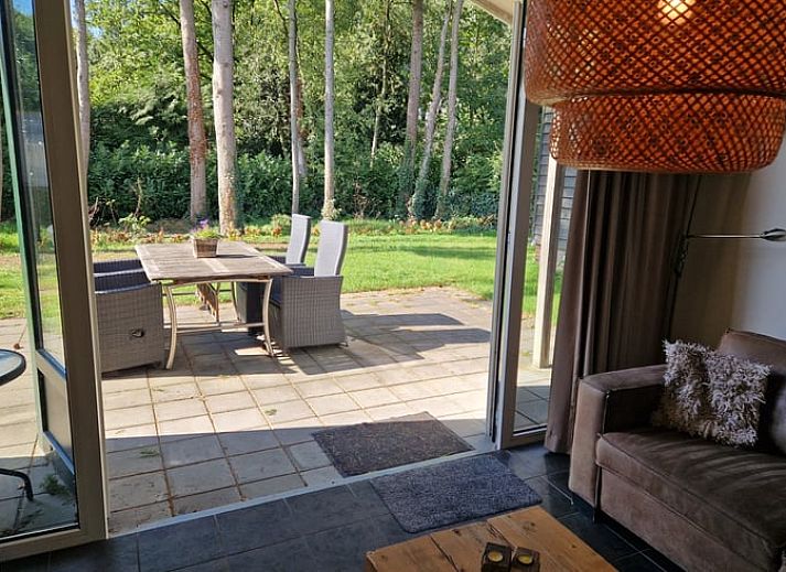 Charming vacation home in Putten, Veluwe, Gelderland with green surroundings and cozy outdoor space.