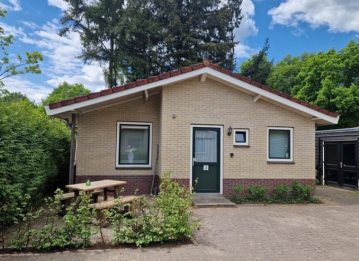 Bright living room of vacation home in Putten, Veluwe, Gelderland overlooking garden.