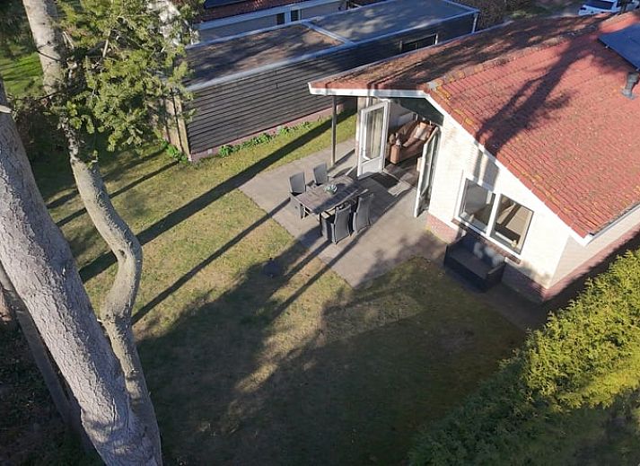 Bright living room of vacation home in Putten, Veluwe, Gelderland overlooking garden.