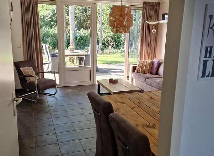 Bright living room of vacation home in Putten, Veluwe, Gelderland overlooking garden.