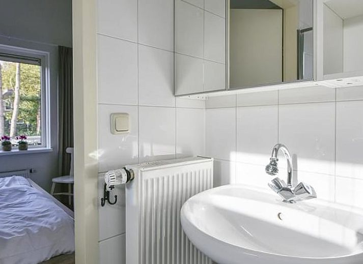 Open terrace of vacation home in Putten, Veluwe, Gelderland overlooking green nature.