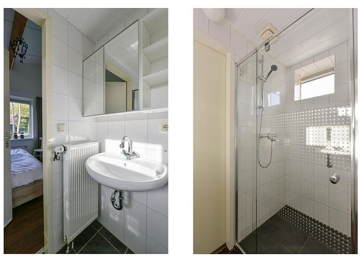 Comfortable sitting area in vacation home in Putten, Veluwe, Gelderland overlooking terrace.