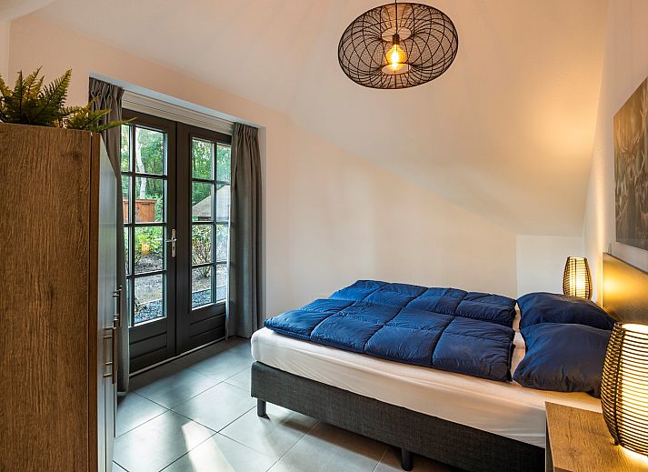 Rueckansicht des Ferienhauses Sprielderbosch 31 Lindenhorst, umgeben von Natur in Putten, Veluwe.