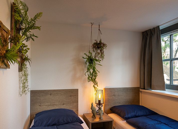 Gemuetliche Terrasse mit Haengematte im Holiday home Sprielderbosch 31 Lindenhorst in Putten, Veluwe.