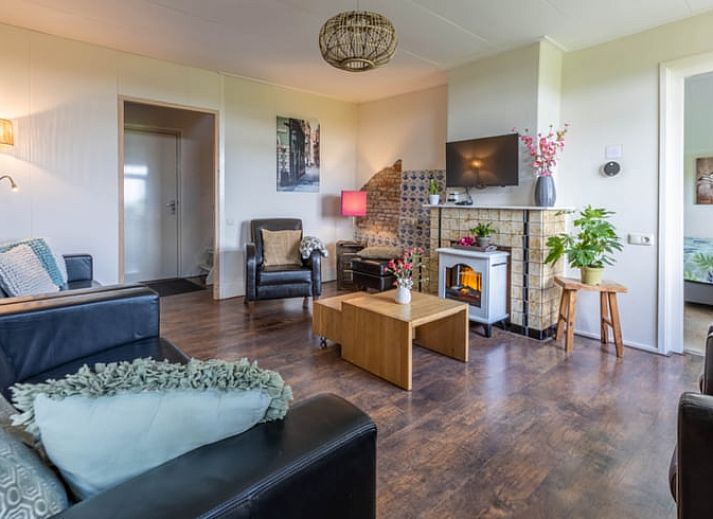 Cozy living room of Holiday home in Wezep Oldebroek, Veluwe, Gelderland with comfortable seating area.