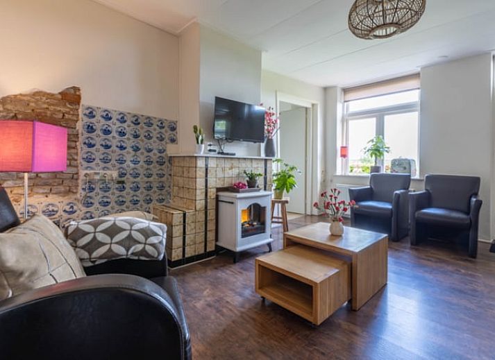 Cozy living room of Holiday home in Wezep Oldebroek, Veluwe, Gelderland with comfortable seating area.