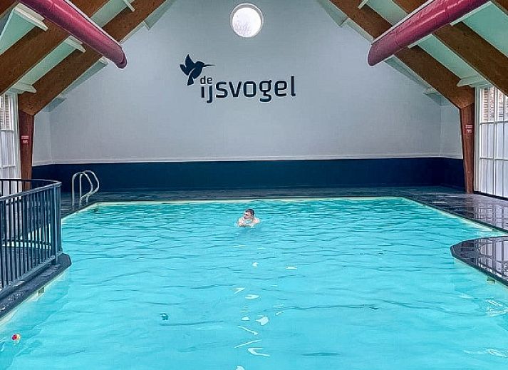 Comfortable bedroom in Het Veluws Paradijs, Voorthuizen, with breakfast in bed and views of nature.