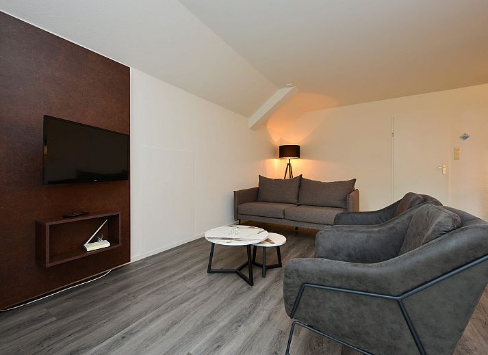 Rear of detached house in Vaassen, Veluwe, with green surroundings.