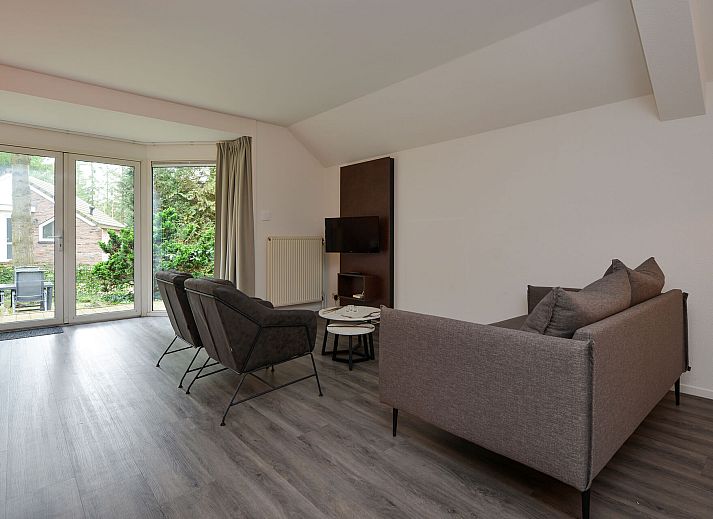 Rear of detached house in Vaassen, Veluwe, with green surroundings.