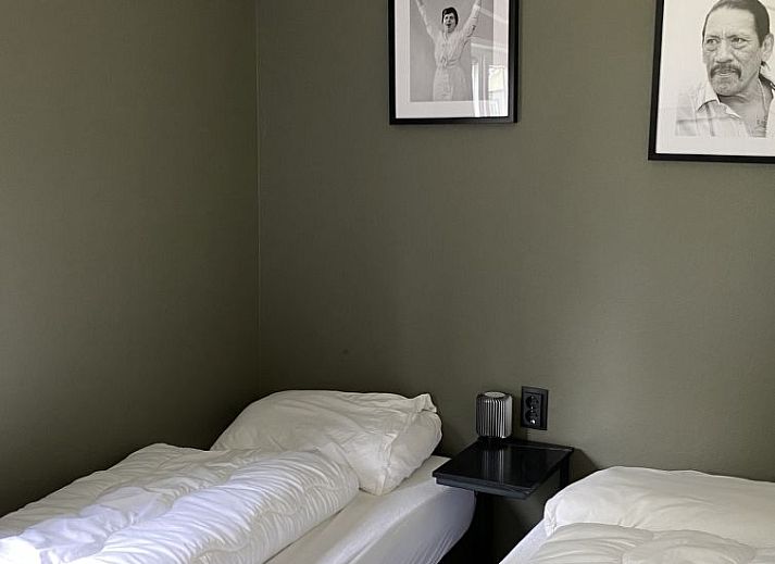 Gezellige woonkamer in Vakantiehuis Hackfort 6, Hulshorst, Veluwe met moderne inrichting.