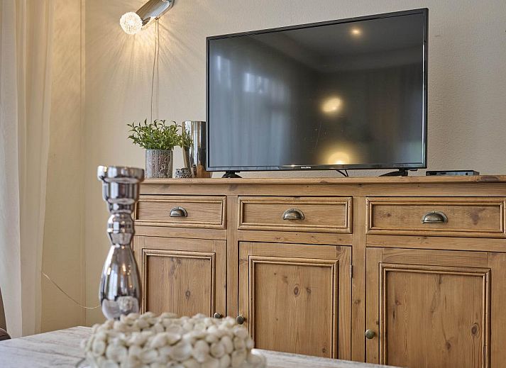 Charmante veranda van vakantiehuis Kerkuil in Hulshorst, Veluwe, met uitnodigende zitgelegenheid.