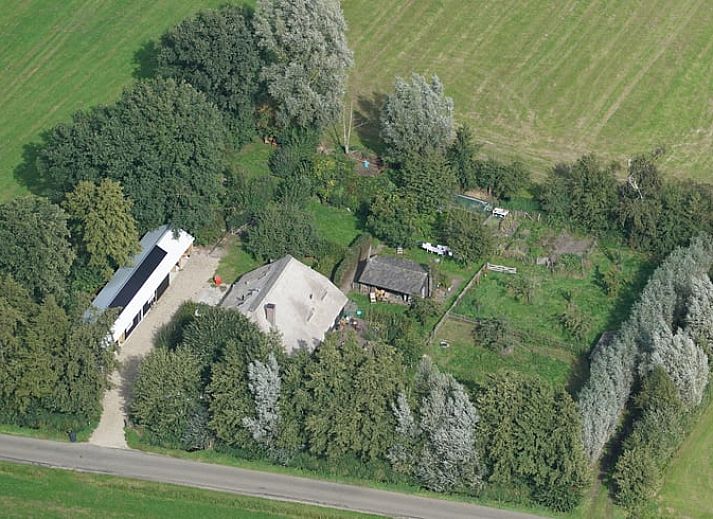 Charmant vakantiehuis in Hulshorst met rieten dak, omgeven door natuur in de Veluwe, Gelderland.