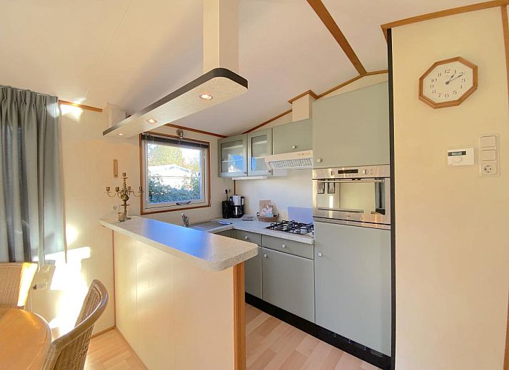 Ferienhaus Haas in Hulshorst, Veluwe, Gelderland mit gruener Veranda und Garten.