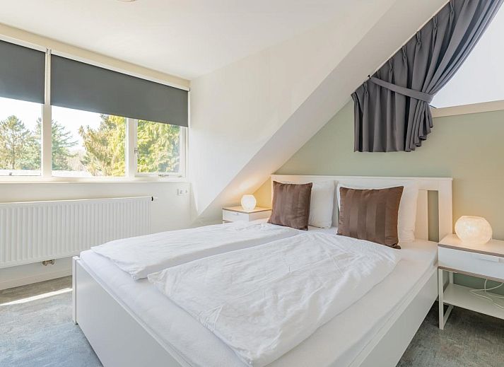 Gemuetliches, modern eingerichtetes Wohnzimmer des Ferienhauses Pimpelmees in Hulshorst, Veluwe, Gelderland.