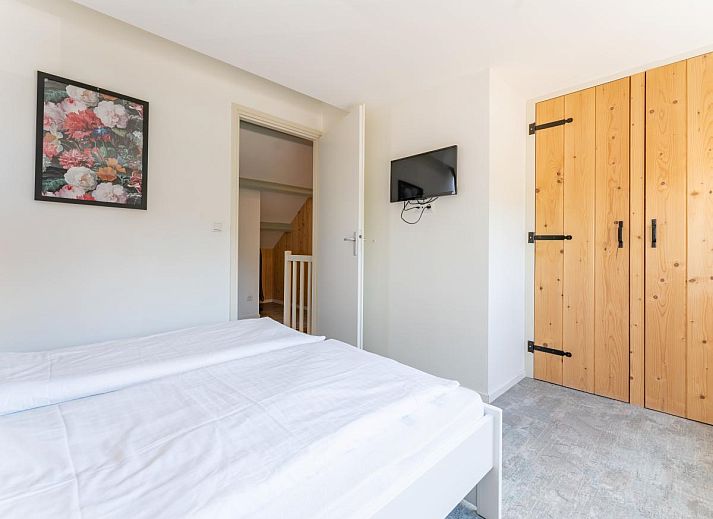 Helles Schlafzimmer im Ferienhaus Pimpelmees in Hulshorst, Veluwe mit bequemem Doppelbett.