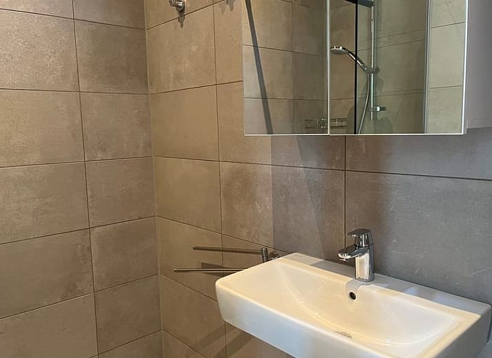 Modern kitchen and sitting area in Cottage in Otterlo, a vacation accommodation in Otterlo, Veluwe, Gelderland.