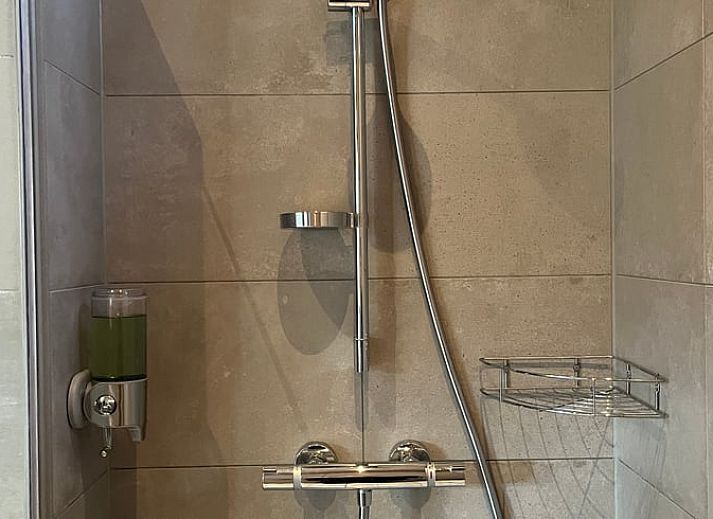 Modern kitchen and sitting area in Cottage in Otterlo, a vacation accommodation in Otterlo, Veluwe, Gelderland.