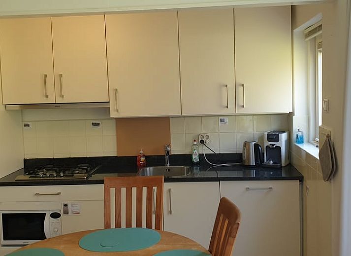 Vakantiehuis in Otterlo biedt een charmante tuin met terras, omgeven door de natuur van de Veluwe, Gelderland.