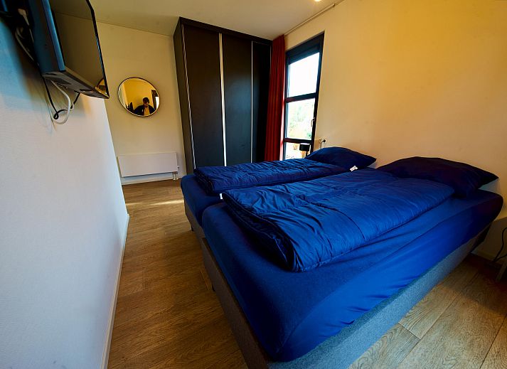 Vrijstaande woning in Otterlo op de Veluwe, Gelderland, met een ruim terras en omringd door natuur, ideaal voor een rustige vakantie.