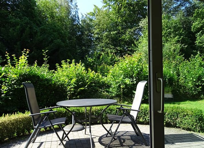 Vacation home in Epe surrounded by the green nature of the Veluwe, Gelderland, with a beautiful view of the wooded landscape.